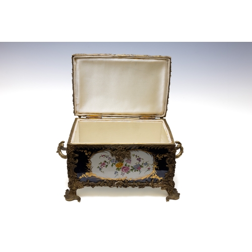 117 - An Antique Continental Porcelain & Bronze Box.

Approximately 30x19cm