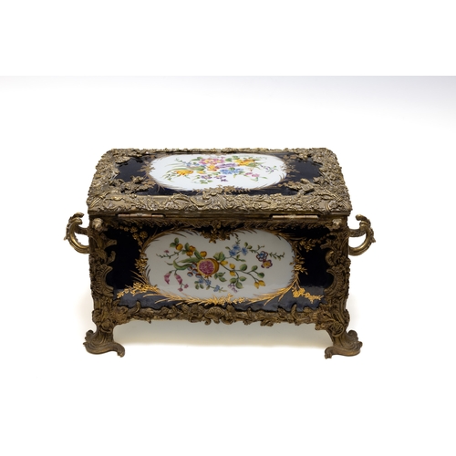 117 - An Antique Continental Porcelain & Bronze Box.

Approximately 30x19cm