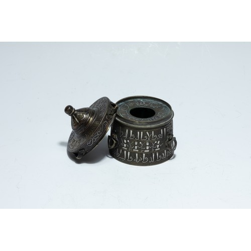 288 - An Islamic Khorasan Bronze Inkwell with Silver Inlay from the 13th Century.

H: Approximately 10cm
D... 