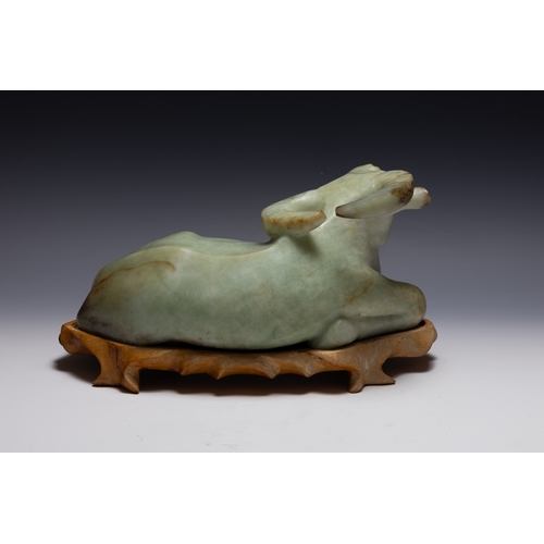 375 - A Chinese Large Jade Figure of a Buffalo with a Wooden Stand.

H: Approximately 19cm
L: Approximatel... 