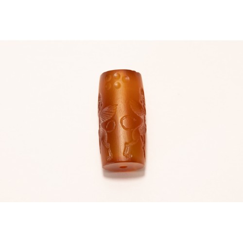 225 - An Agate Carnelian Cylindrical Seal in the Style of the Babylonian Period.

L: Approximately 2.9cm