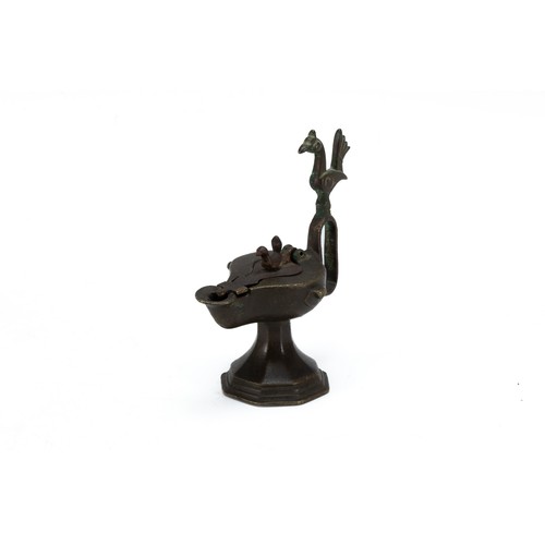 293 - An Islamic Bronze Oil Lamp from the 12th Century.

H: Approximately 15cm