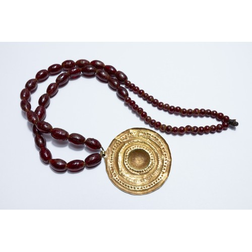 242 - A Roman Gold Hoop Head Necklace with Red Glass Beads.