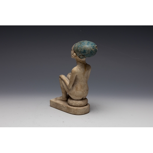 259 - An Egyptian Style Figure of a Seated Man.

H: Approximately 15.8cm