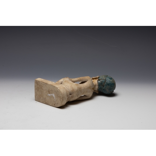 259 - An Egyptian Style Figure of a Seated Man.

H: Approximately 15.8cm