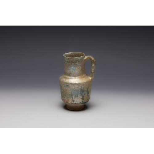 297 - An Islamic Kashan Ceramic Jug from the 12th Century.

H: Approximately 11.3cm