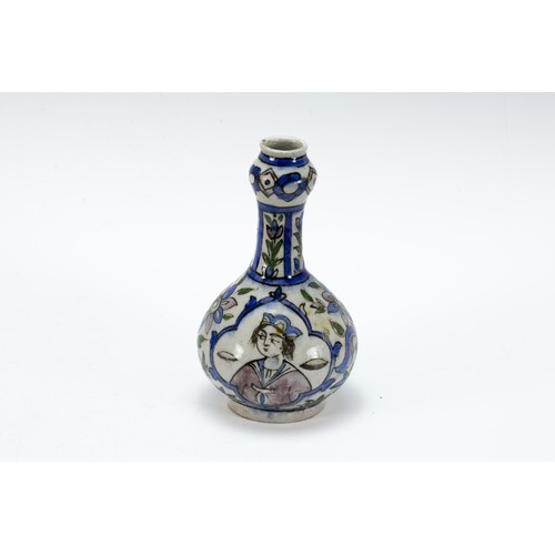 321 - An Islamic Qajar Ceramic Vase from the 19th Century Depicting Floral Patterns.

H: Approximately 28c... 