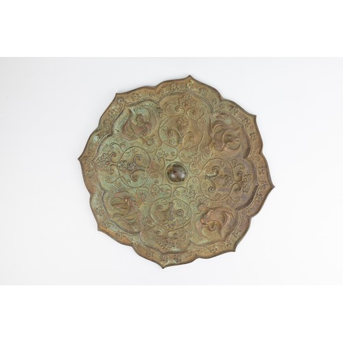 71 - **NO RESERVE**

A Chinese Bronze Mirror Depicting Phoenixes and Floral Patterns.

L: Approximately 2... 