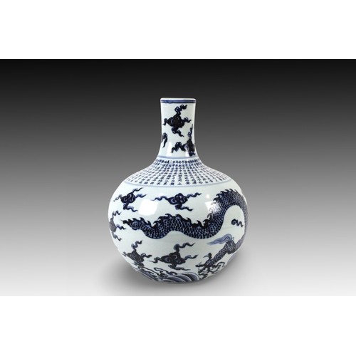 73 - A Chinese Blue & White Flower Pot from the 20th Century with a Dragon Design and Chinese Writing

He... 