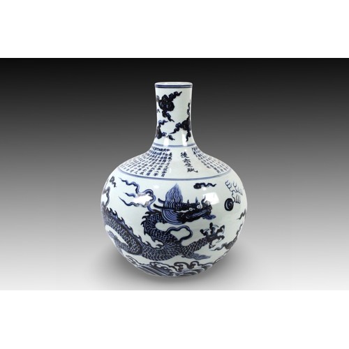 73 - A Chinese Blue & White Flower Pot from the 20th Century with a Dragon Design and Chinese Writing

He... 