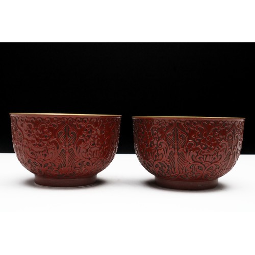 79 - A Rare Chinese Pair of Porcelain Coral Red Bowls with Four-Figure Character Marks on the Base.

D: A... 