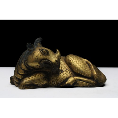 81 - A Chinese Gold Gilt Bronze Figure of a Rhino Probably Ming Dynasty.

L: Approximately 12cm