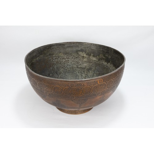 164 - An Islamic Middle Eastern Large Copper Bowl with Intricate Carving of Floral Patterns and Islamic Ca... 