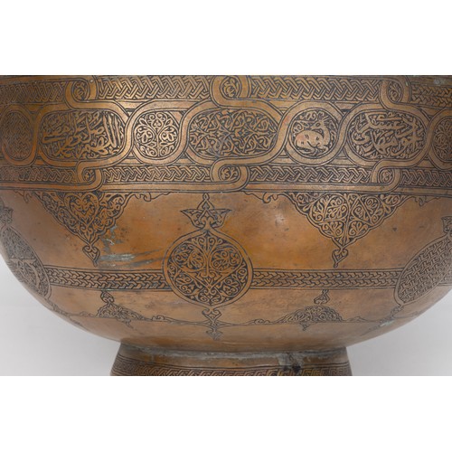 164 - An Islamic Middle Eastern Large Copper Bowl with Intricate Carving of Floral Patterns and Islamic Ca... 