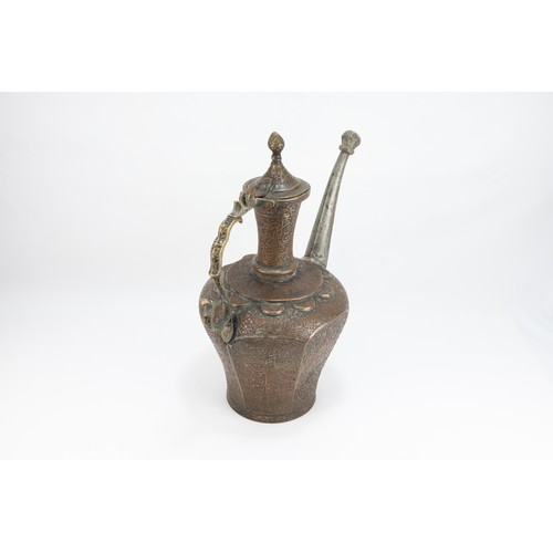 166 - An Islamic Persian Copper Water Jug with Intricate Carvings of Floral Patterns and Islamic Calligrap... 