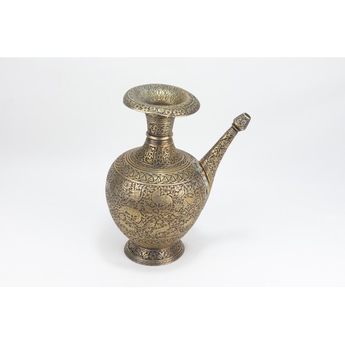 167 - An Islamic Persian Brass Water Jug with intricate Carvings of Floral Patterns, Animals and Islamic C... 