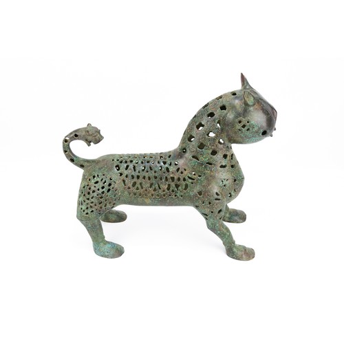 175 - An Islamic Bronze Incense Burner in the Figure of a Lion.

H: Approximately 27cm
L: Approximately 31... 