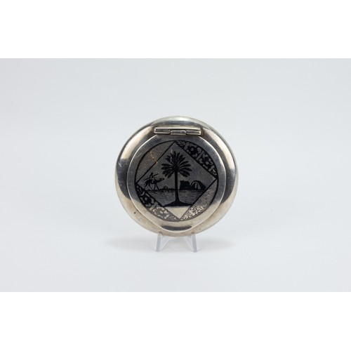 177 - An Islamic Iraqi Silver Compact Mirror with Niello Work

D: Approximately 7.6cm
82g