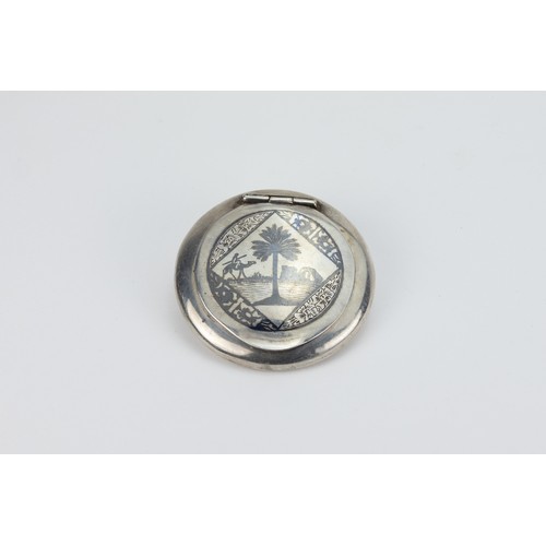 177 - An Islamic Iraqi Silver Compact Mirror with Niello Work

D: Approximately 7.6cm
82g