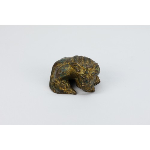 89 - **NO RESERVE**
A Chinese Bronze Gilt Paperweight in the Figure of a Lion.
L: Approximately 6.8cm