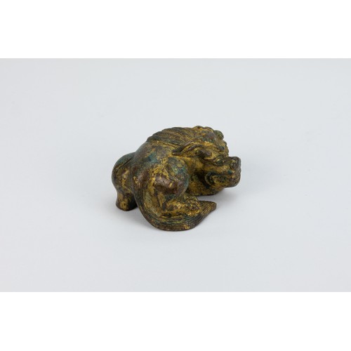 89 - **NO RESERVE**
A Chinese Bronze Gilt Paperweight in the Figure of a Lion.
L: Approximately 6.8cm