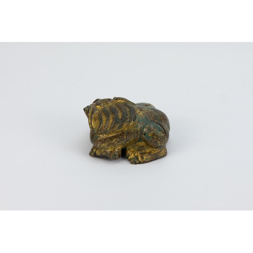 89 - **NO RESERVE**
A Chinese Bronze Gilt Paperweight in the Figure of a Lion.
L: Approximately 6.8cm