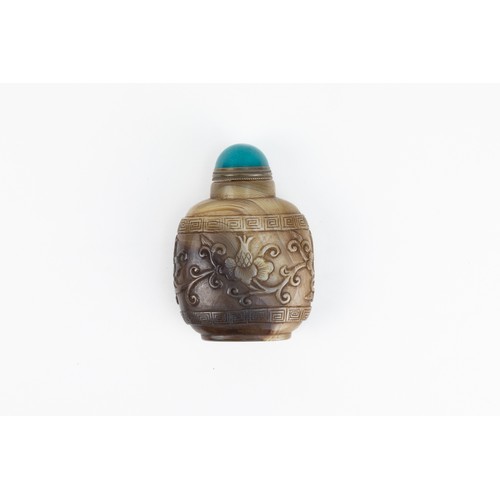 90 - A Chinese Agate Snuff Bottle with Intricate Carvings of Floral Patterns.

H: Approximately 8cm