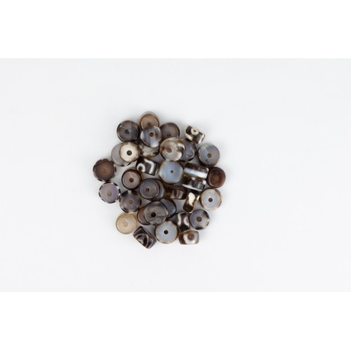 258 - A Lot of 32 Tibetan Dzi Beads.

D: Approximately 1.5cm