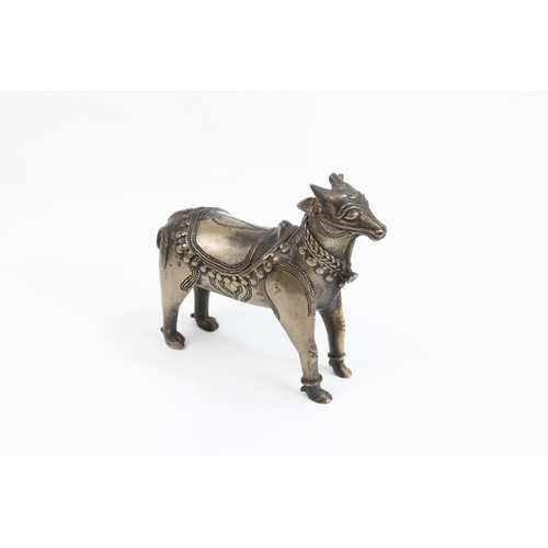 123 - An Indian Mughal Bronze Figure of a Cow.

L: Approximately 14.5cm