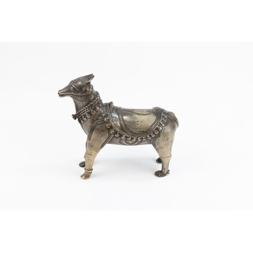 123 - An Indian Mughal Bronze Figure of a Cow.

L: Approximately 14.5cm