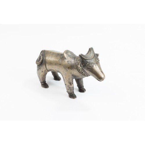 124 - An Indian Mughal Bronze Figure of a Cow.

L: Approximately 15.2cm