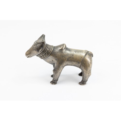 124 - An Indian Mughal Bronze Figure of a Cow.

L: Approximately 15.2cm