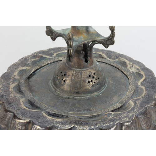 191 - An Islamic Khorasan Bronze Candle Stand from the 12th Century Decorated with Intricate Carvings of K... 