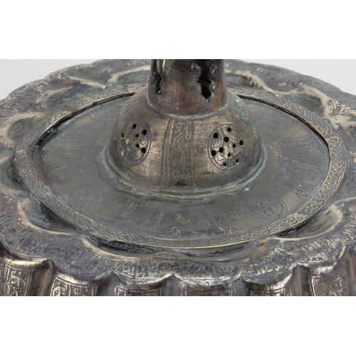 191 - An Islamic Khorasan Bronze Candle Stand from the 12th Century Decorated with Intricate Carvings of K... 