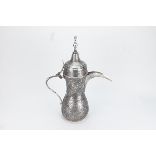 194 - An Islamic Middle Eastern Silver-Tested Coffee Pot

H: Approximately 32.5cm
600g