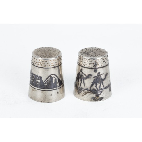 205 - A Pair of Islamic Iraqi Silver Thimbles with Niello Work.

H: Approximately 2cm