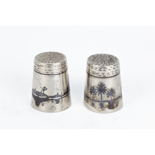 205 - A Pair of Islamic Iraqi Silver Thimbles with Niello Work.

H: Approximately 2cm