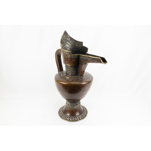 261 - A Tibetan Large Copper Monk's Cap Ewer Decorated with White Metal from the 19th Century.

H: Approxi... 