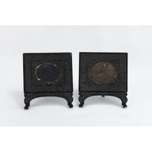 134 - A Pair of Anglo Indian Ebony Carved Frames from the 19th Century.

H: Approximately 13.5cm