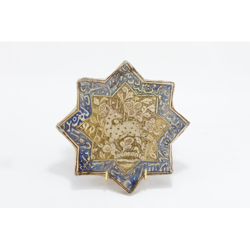 219 - An Islamic Kashan Moulded Tile in the Shape of a Star from the 14th Century.

L: Approximately 20.5c... 