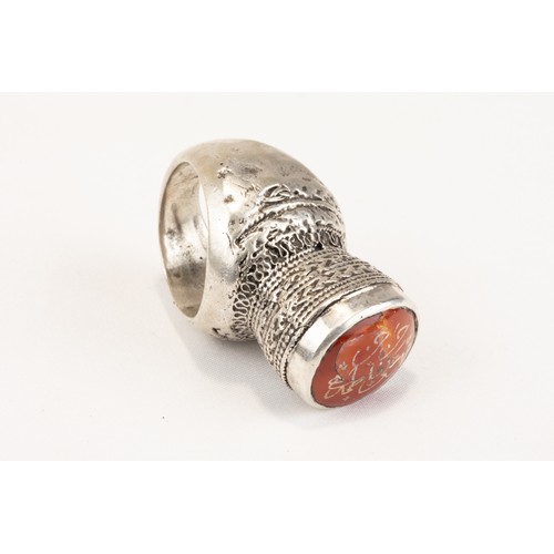 62 - An Islamic Tribal Turkman Silver Ring Decorated with Islamic Calligraphy in Carnelian from the Mid 2... 