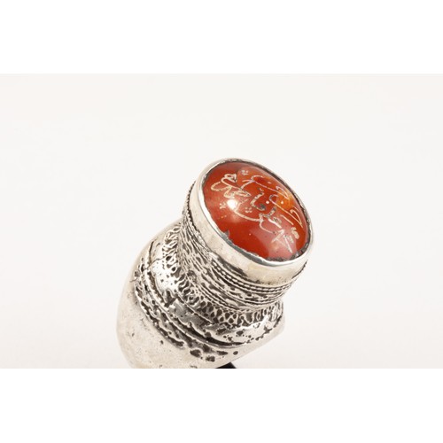 62 - An Islamic Tribal Turkman Silver Ring Decorated with Islamic Calligraphy in Carnelian from the Mid 2... 