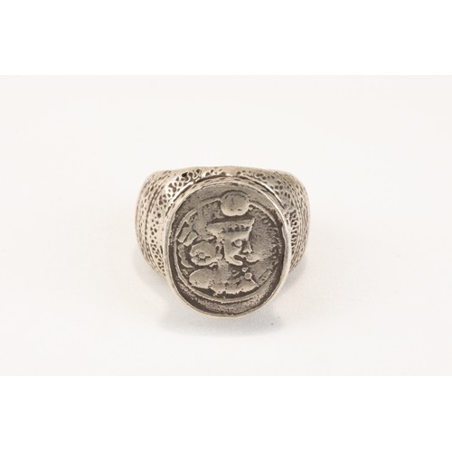 63 - An Islamic Tribal Turkmen Silver Ring with a Sasanian Coin.

77g