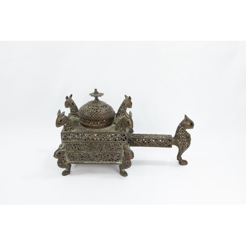 222 - An Islamic Bronze Incense Burner Decorated with Lion Heads and Silver Inlay & Intricate Openwork.

L... 