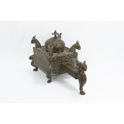 222 - An Islamic Bronze Incense Burner Decorated with Lion Heads and Silver Inlay & Intricate Openwork.

L... 