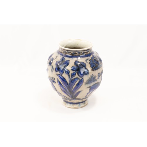 224 - An Islamic Persian Safavid Pottery Urn Decorated with Floral Patterns in Blue.

H: Approximately 17c... 