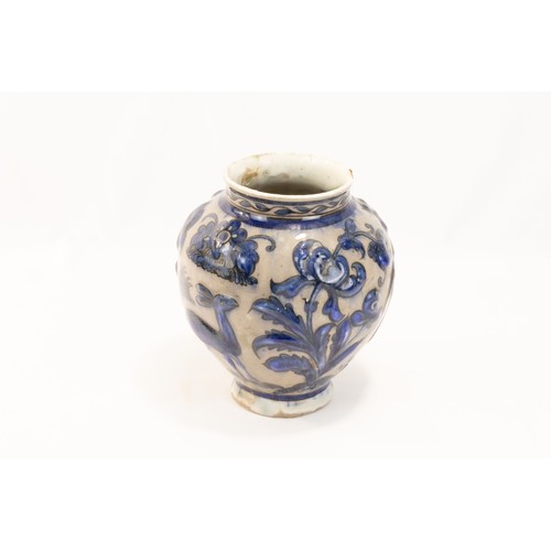 224 - An Islamic Persian Safavid Pottery Urn Decorated with Floral Patterns in Blue.

H: Approximately 17c... 