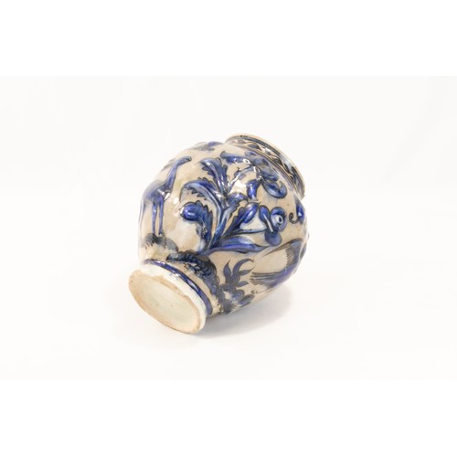 224 - An Islamic Persian Safavid Pottery Urn Decorated with Floral Patterns in Blue.

H: Approximately 17c... 