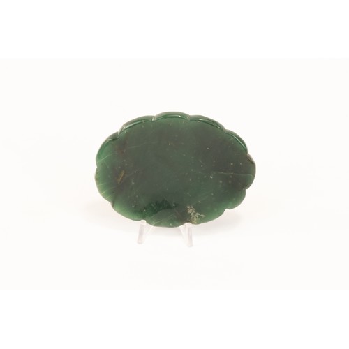 140 - An Indian Mughal-Style Green Jade Pendant Decorated with Red Gem Stones.

L: Approximately 7cm