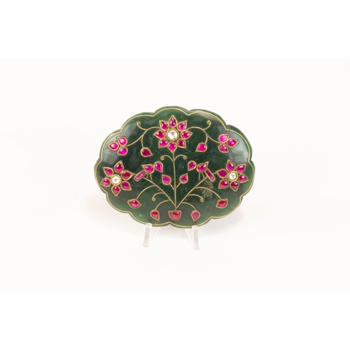 140 - An Indian Mughal-Style Green Jade Pendant Decorated with Red Gem Stones.

L: Approximately 7cm